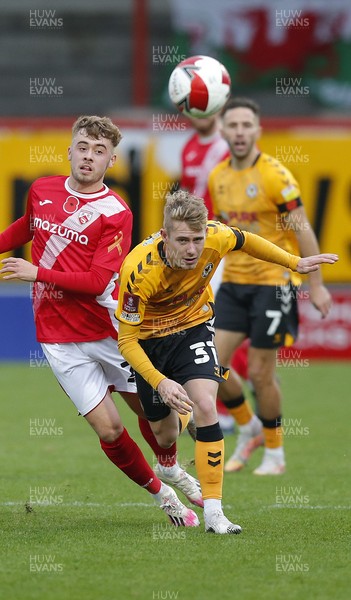 061121 - Morecambe v Newport County - FA Cup First Round - Oli Cooper of Newport County and Alfie McCalmont of Morecambe FC
