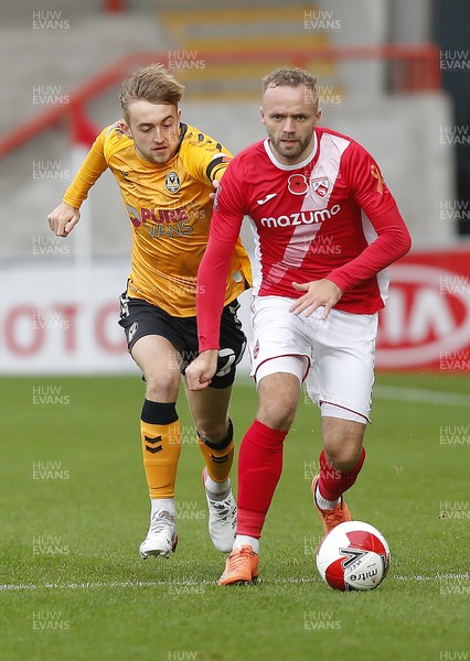 061121 - Morecambe v Newport County - FA Cup First Round - Jake Cain of Newport County and Ryan McLaughlin of Morecambe FC