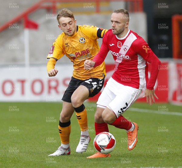 061121 - Morecambe v Newport County - FA Cup First Round - Jake Cain of Newport County and Ryan McLaughlin of Morecambe FC