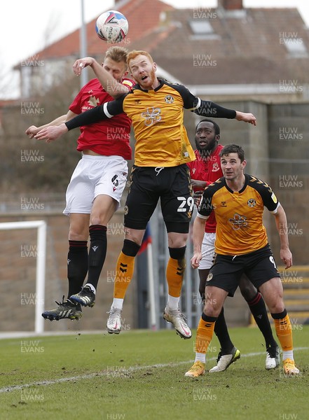 130321 - Morecambe v Newport County - Sky Bet League 2 - Ryan Taylor of Newport County in aerial battle with Harry Davis of Morecambe FC