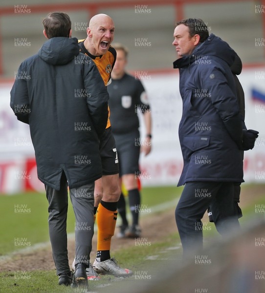 130321 - Morecambe v Newport County - Sky Bet League 2 - Kevin Ellison of Newport County scores the 3rd goal and pointedly celebrates in front of the home bench and the Manager Derek Adams of Morecambe FC [his team until he joined Newport this season]