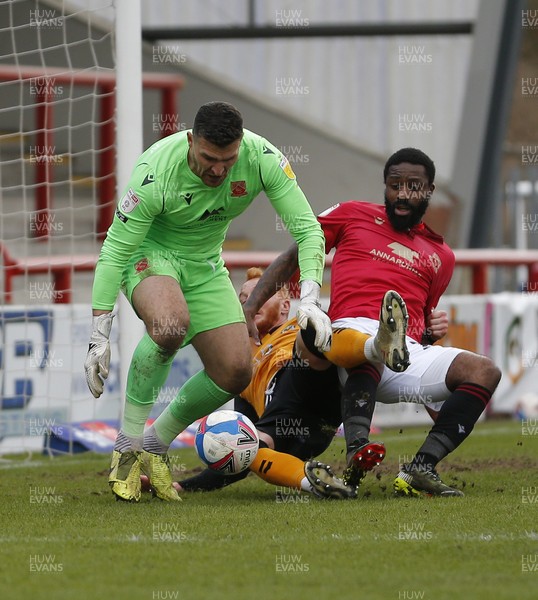130321 - Morecambe v Newport County - Sky Bet League 2 - Ryan Taylor of Newport County and Yann Songo'o of Morecambe FC and Goalkeeper Kyle Letheren of Morecambe FC takes the ball