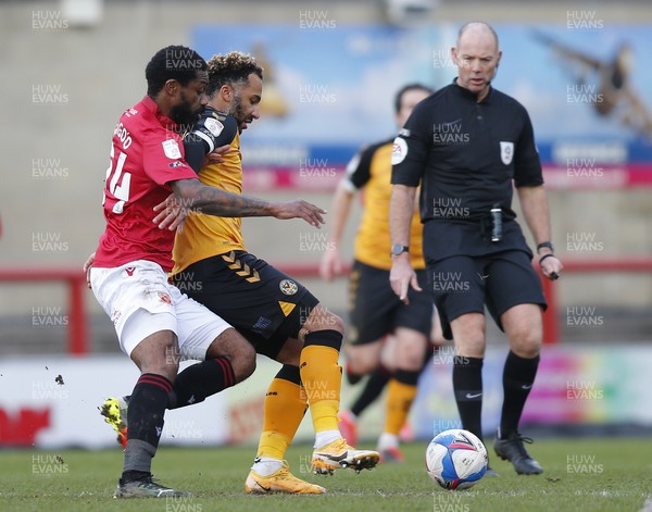 130321 - Morecambe v Newport County - Sky Bet League 2 - Nicky Maynard of Newport County is tackled by Yann Songo'o of Morecambe FC