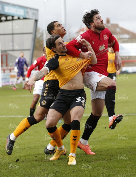 130321 - Morecambe v Newport County - Sky Bet League 2 - Liam Shephard of Newport County and Priestley Farquharson of Newport County and Cole Stockton of Morecambe FC await the oncoming ball