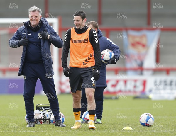 130321 - Morecambe v Newport County - Sky Bet League 2 - Padraig Amond of Newport County has a laugh with coaching staff before the match