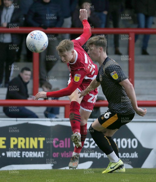 211219 - Morecambe v Newport County - Sky Bet League 2 -  George Tanner of Morecambe clears from George Nurse of Newport County
