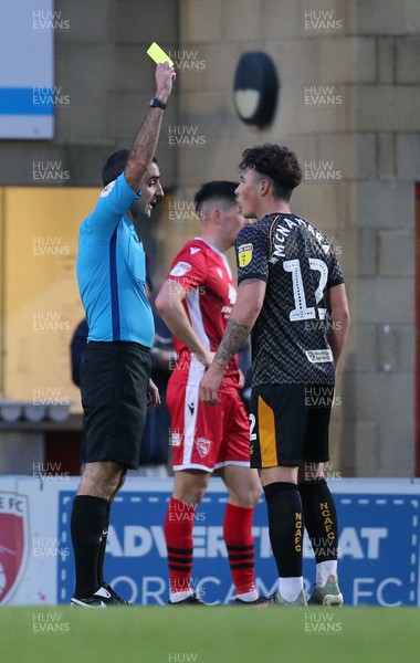211219 - Morecambe v Newport County - Sky Bet League 2 -  Danny McNamara of Newport County gets a yellow from referee Paul Marsden in the 2nd half