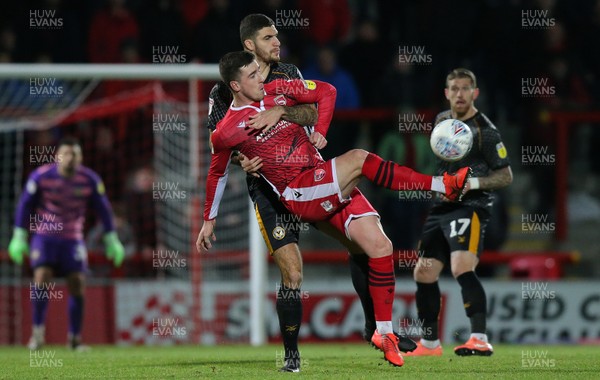 211219 - Morecambe v Newport County - Sky Bet League 2 -  Ryan Inniss of Newport County clutches Cole Stockton of Morecambe as the ball comes their way