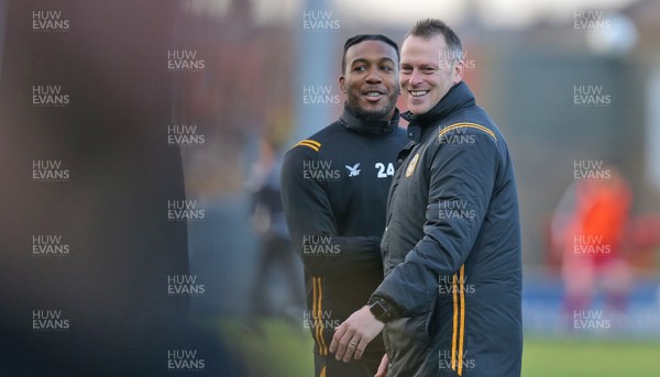 211219 - Morecambe v Newport County - Sky Bet League 2 -  Manager Mike Flynn of Newport County watches the warm up with Dominic Poleon