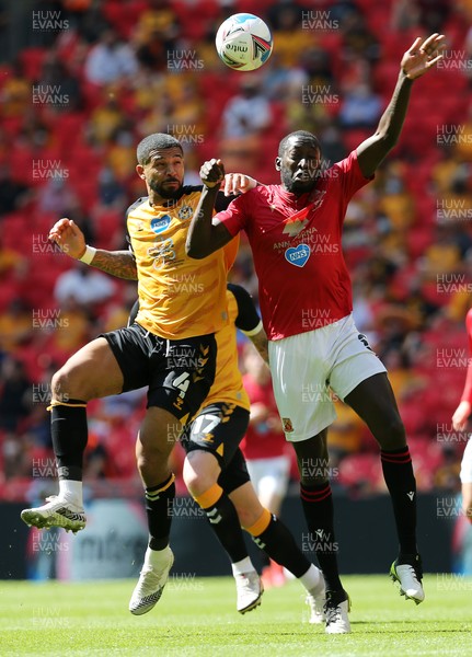 310521 - Morecambe v Newport County, SkyBet League 2 Play Off Final - Joss Labadie of Newport County and Toumani Diagouraga of Morecambe go up for the ball