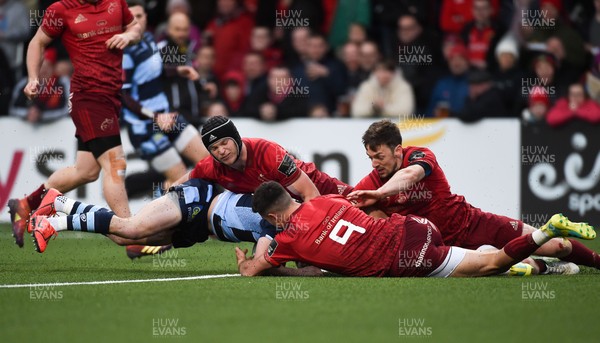 050419 - Munster v Cardiff Blues - Guinness PRO14 -  Tomos Williams of Cardiff Blues scores his side's first try despite the efforts of Tyler Bleyendaal, Conor Murray and Darren Sweetnam of Munster 
