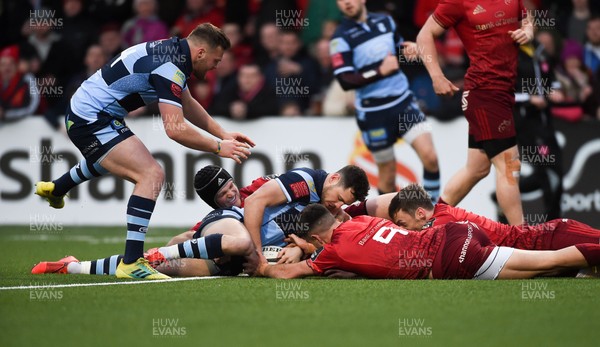 050419 - Munster v Cardiff Blues - Guinness PRO14 -  Tomos Williams of Cardiff Blues scores his side's first try despite the efforts of Tyler Bleyendaal, Conor Murray and Darren Sweetnam of Munster 
