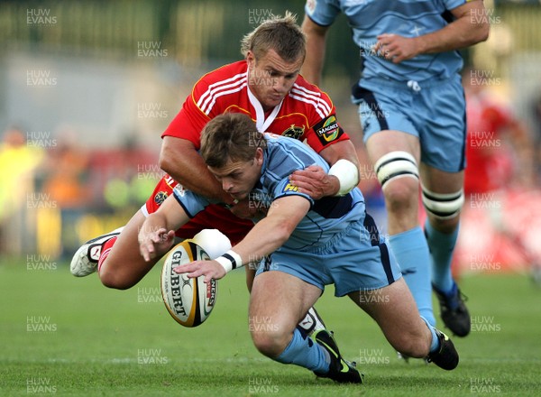 11.09.09 Munster v Cardiff Blues Munsters' Jeremy Manning tackles Ben Blair. 