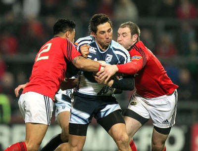 RaboDirect PRO12, Thomond Park, Limerick 24/2/2012Munster vs Cardiff Blues Gavin Henson of Cardiff tackled by Lifeimi Mafi and Johne MurphyMandatory Credit 