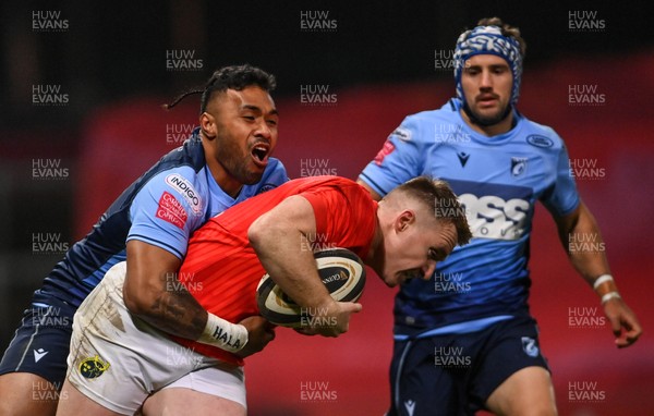 261020 - Munster v Cardiff Blues - Guinness PRO14 - Rory Scannell of Munster is tackled by Willis Halaholo of Cardiff Blues
