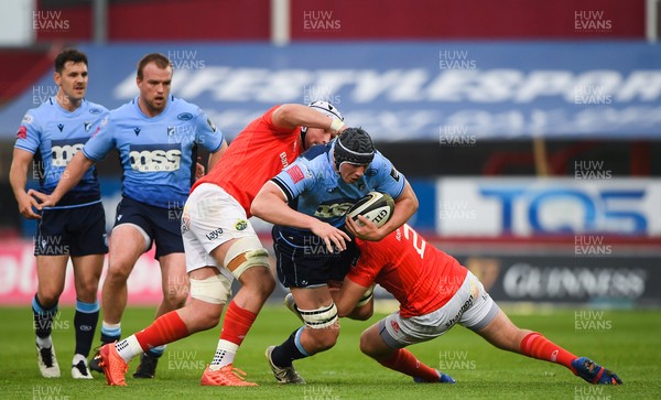 280521 - Munster v Cardiff Blues - Guinness PRO14 Rainbow Cup - Seb Davies of Cardiff Blues is tackled by Fineen Wycherley and Niall Scannell of Munster