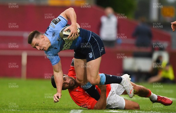 280521 - Munster v Cardiff Blues - Guinness PRO14 Rainbow Cup - Josh Adams of Cardiff Blues is tackled by Niall Scannell of Munster