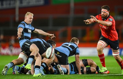 041025 - Munster v Cardiff Rugby, United Rugby Championship - Johan Mulder of Cardiff Rugby kicks clear as Jean Kleyn of Munster closes in