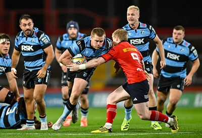 041025 - Munster v Cardiff Rugby, United Rugby Championship - Dan Thomas of Cardiff Rugby is tackled by Ethan Coughlan of Munster