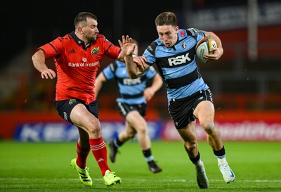 041025 - Munster v Cardiff Rugby, United Rugby Championship - Josh Adams of Cardiff Rugby takes on Dan Kelly of Munster