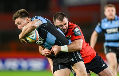041025 - Munster v Cardiff Rugby, United Rugby Championship - Josh Adams of Cardiff Rugby is tackled by Dan Kelly of Munster 
