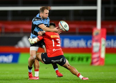 041025 - Munster v Cardiff Rugby, United Rugby Championship - Ioan Lloyd of Cardiff Rugby is tackled by Dan Kelly of Munster 