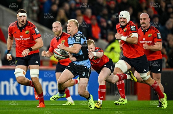 041025 - Munster v Cardiff Rugby, United Rugby Championship - Johan Mulder of Cardiff Rugby makes a break despite the efforts of Ethan Coughlan of Munster 
