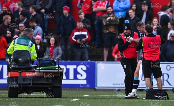 290422 - Munster v Cardiff Rugby - United Rugby Championship - Hallam Amos of Cardiff Blues is helped to a medical cart