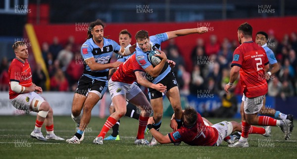 290422 - Munster v Cardiff Rugby - United Rugby Championship - Max Llewellyn of Cardiff is tackled by Alex Kendellen of Munster