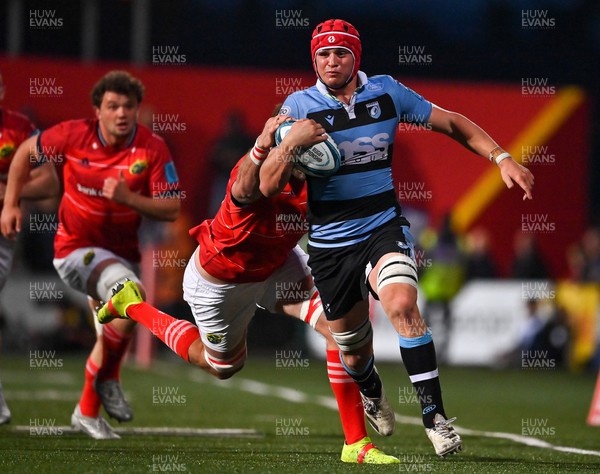 290422 - Munster v Cardiff Rugby - United Rugby Championship - James Botham of Cardiff Blues is tackled by Jason Jenkins of Munster