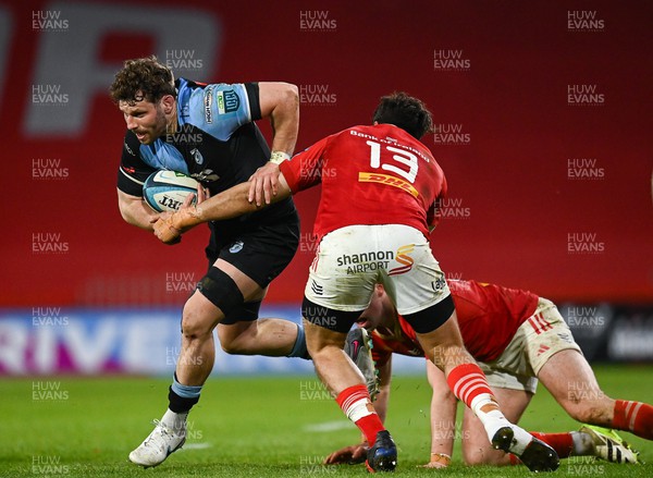 300324 - Munster v Cardiff Rugby - United Rugby Championship - Thomas Young of Cardiff is tackled by Antoine Frisch of Munster