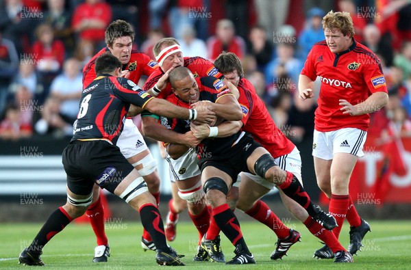 03.09.11 Munster v Dragons... Munster's Mick O'DriscolL tackles Gavin Thomas of Dragons 