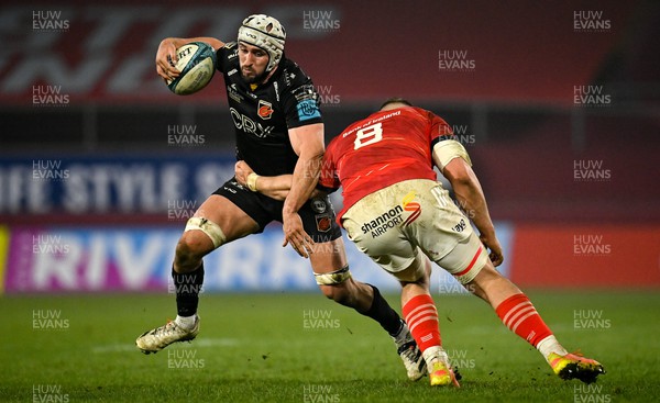 050322 - Munster v Dragons - United Rugby Championship - Ollie Griffiths of Dragons is tackled by Gavin Coombes of Munster
