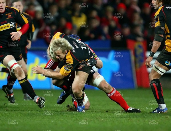 Magners League, Musgrave Park 24/11/2007 Munster vs Newport Gwent Dragons Munster's Alan Quinlan tackles Ashley Smith of Dragons  