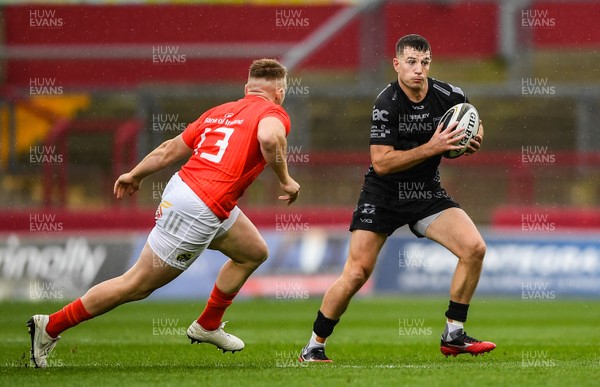 280919 -  Munster and Dragons - Guinness PRO14 -  Owen Jenkins of Dragons in action against Rory Scannell of Munster