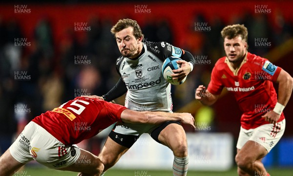 041123 - Munster v Dragons - United Rugby Championship - Rhodri Williams of Dragons is tackled by Shane Daly of Munster