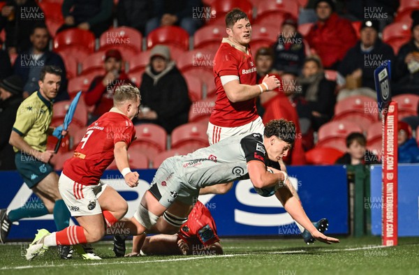 041123 - Munster v Dragons - United Rugby Championship - James Benjamin of Dragons dives over to score his side's first try, under pressure from Craig Casey of Munster (9)