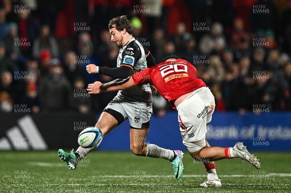 041123 - Munster v Dragons - United Rugby Championship - Rhodri Williams of Dragons in action against Brian Gleeson of Munster