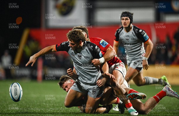 041123 - Munster v Dragons - United Rugby Championship - Jack Dixon of Dragons is tackled by Alex Nankivell of Munster