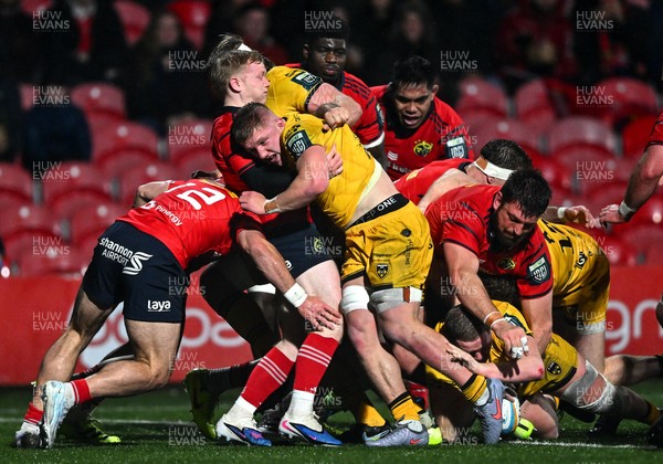 230126 - Munster v Dragons RFC - United Rugby Championship - Brodie Coghlan of Dragons, hidden, dives over to score his side's first try