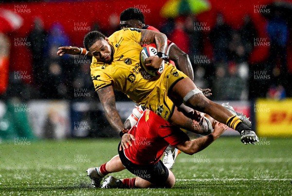 230126 - Munster v Dragons RFC - United Rugby Championship - Levi Douglas of Dragons is tackled by Jeremy Loughman of Munster