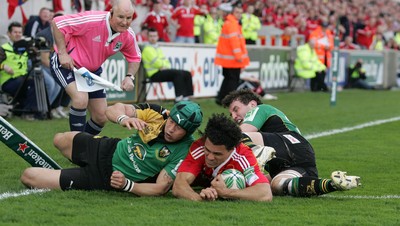 10.04.10 - Munster v Northampton Saints - Heineken Cup Semi-Final -  Doug Howlett scores for Munster despite the tackles of Bruce Reihana and Ben Foden of Northampton 