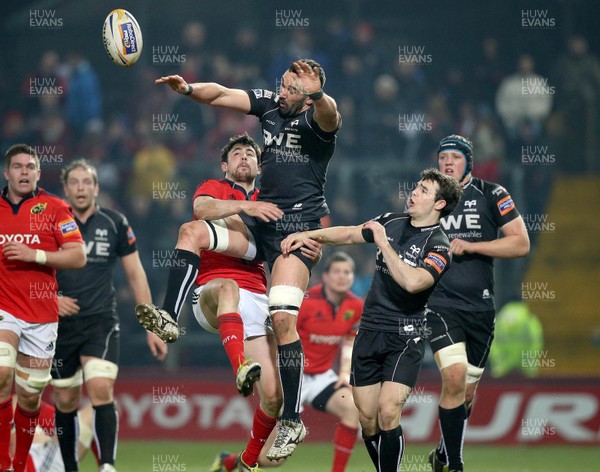 020313 Munster v Ospreys - RaboDirect Pro 12 - Jonathan Thomas of Ospreys is tackled by Munster's Felix Jones 