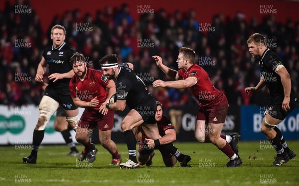 021217 - Munster v Ospreys - Guinness PRO14 -   Scott Baldwin of Ospreys is tackled by Ian Keatley and Rory Scannell of Munster