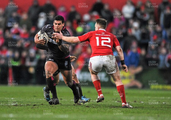 140216 - Munster v Ospreys - Guinness PRO12 - Josh Matavesi of Ospreys is tackled by Rory Scannell of Munster