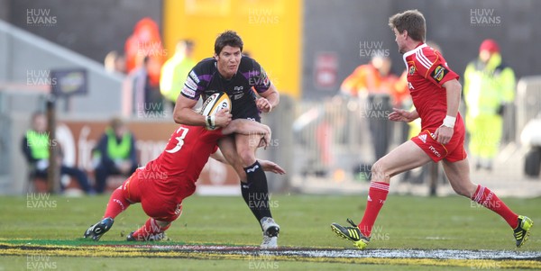 14.05.11 - Musnter v Ospreys... Ospreys James Hook is tackled by Munster's Ronan O'Gara.. 