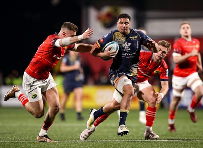 030323 - Munster v Scarlets - United Rugby Championship - Dan Davis of Scarlets breaks through the Munster defence