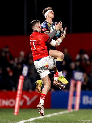 030323 - Munster v Scarlets - United Rugby Championship - Tom Rogers of Scarlets claims possession ahead of Shane Daly of Munster