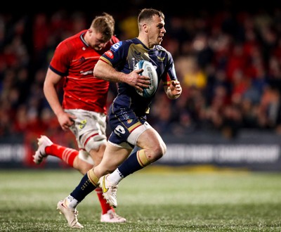 030323 - Munster v Scarlets - United Rugby Championship - Gareth Davies of Scarlets on his way to scoring his side's fifth try