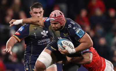 030323 - Munster v Scarlets - United Rugby Championship - Sione Kalamafoni of Scarlets is tackled by Malakai Fekitoa of Munster